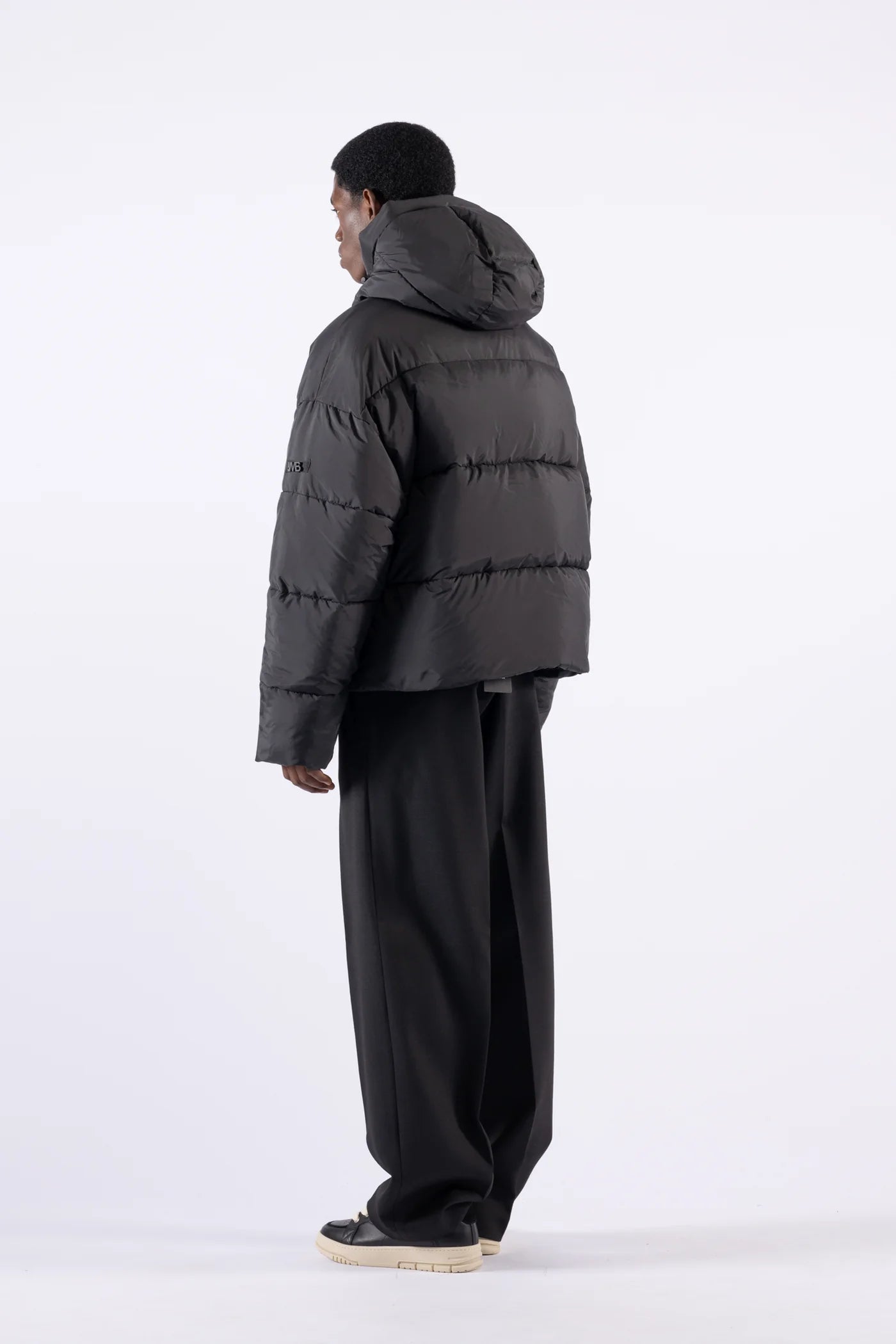 Piumino oversize con cappuccio - Nero